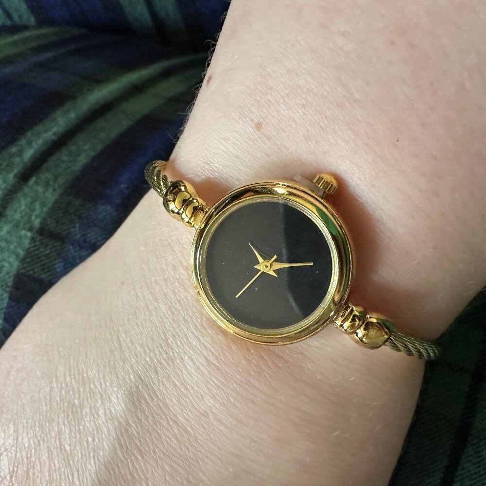 gold tone round bracelet watch